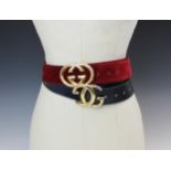 A Gucci red suede leather belt, stamped 'Made in Italy by Gucci' with attached gilt metal double G
