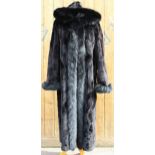 A ladies hooded and reversible mink fur winter long coat, late 20th century, with black fox fur trim