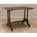 A 19th century mahogany writing table, the serpentine shaped top inset with a gilt tooled skiver,