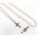 A selection of jewellery, including a 9ct yellow gold cross, of plain polished form, upon an