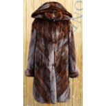 A ladies hooded and reversible winter three-quarter length mink fur coat, late 20th century, with