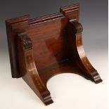 A Victorian mahogany bracket clock wall bracket, of inverted breakfront form, upon curved supports
