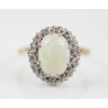 A mid-20th century white opal and diamond cluster ring, the oval cabochon opal in white metal double