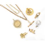A selection of yellow metal and 9ct yellow gold jewellery, including a trace link chain with bolt