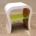 An acrylic white tooth table, circa 1970, of molar form with mirrored under tier, 60cm H x 54cm W