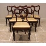 A matched set of six Victorian mahogany dining chairs, each chair with a compressed balloon back