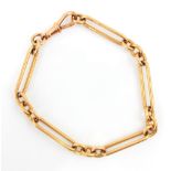 A 9ct yellow gold fancy link bracelet, the elongated links with three circular trace links
