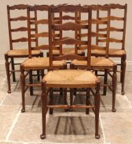 A set of six oak Lancashire ladder back dining chairs, late 19th/early 20th century, each with