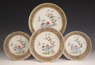 A set of four Chinese porcelain reticulated plates, Qianlong (1736-1795), each circular plate