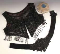 A 1920s flapper style black beaded Bolero, approximately 44cm pit to pit, with a 1920s lady's beaded