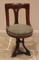 A walnut and upholstered revolving ships office chair, late 19th early/20th century, the