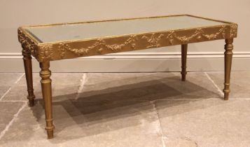 A painted giltwood coffee table, in the 18th century Italian taste, the rectangular bevelled
