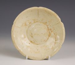 A Chinese porcelain Song Dynasty (960 -1279) bowl, the pale celadon glazed bowl of small lobed