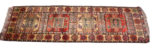A Qashqai Persian type runner, in red, blue and cream colourways, the four alternating rectangular
