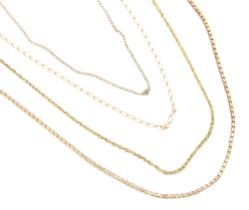 A selection of four 9ct yellow gold and yellow metal chains, including a box link example, elongated