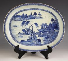 A Chinese porcelain blue and white oval plate, 18th century, centrally decorated with a river