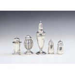 A group of silver pepperettes, including a Victorian silver example, M.Bro, Birmingham 1886, with