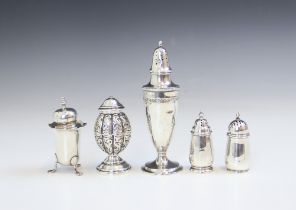 A group of silver pepperettes, including a Victorian silver example, M.Bro, Birmingham 1886, with