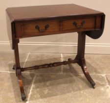 A Regency style mahogany sofa table, mid 20th century, the rectangular drop leaf top with rounded