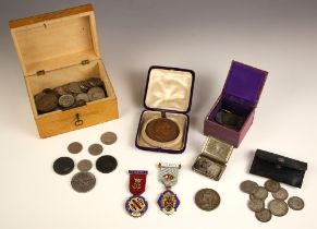 A collection of English and foreign silver and copper coins, including one shilling dated 1951,