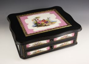 A KPM tile and ebonised ladies toilet box circa 1860, the serpentine outlined hinged cover inset