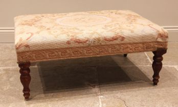 An Aubusson type tapestry upholstered footstool, late 20th century, the rectangular padded seat in