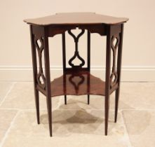 An Edwardian Art Nouveau mahogany occasional table, in the manner of J.S. Henry, London, the triform