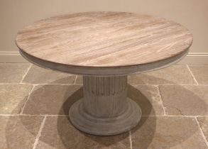 An Oka limed oak and painted pedestal centre table, early 21st century, the moulded circular top