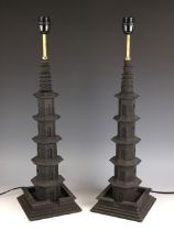 A pair of 'temple' table lamps, probably Oka, each of tapering pagoda form, upon an integral stepped