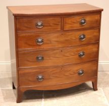 An early 19th century mahogany bowfront chest of drawers, formed with two short over three long