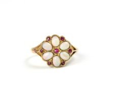 An 18ct yellow gold opal and untested ruby cluster ring, the oval cabochon opals within a petal