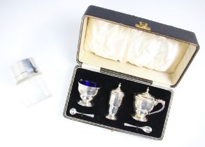 A cased George VI silver condiment set, Ernest W Haywood, Birmingham 1939, comprising wet mustard,