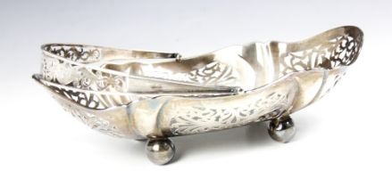 A George V silver swing handled basket, 'WHLd' Birmingham 1922, the openwork gallery with floral
