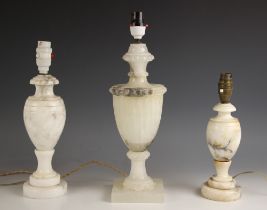 An alabaster lamp base, 20th century, of urn form, with fluted body and beaded shoulders, 39cm high,