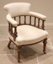 A Victorian walnut library tub chair, in the manner of Holland and Sons, re-upholstered in damask