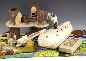 A collection of Star Wars model toys by Kenner and others, to include the Millenium Falcon, Darth
