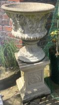 A pair of reconstituted Haddonstone type Campana shaped garden urns, upon associated plinths, 108cm