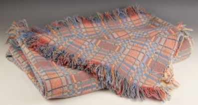 A Welsh blanket, of traditional reversible design, in a pink, purple, and blue colourway, fringe