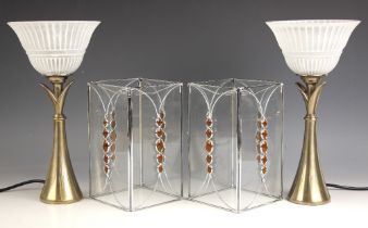 A pair of floral form nickel plated table lamps, 20th century, with frosted glass shades, each 33.