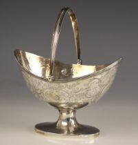 A George III silver sugar basket, possibly Solomon Hougham, London 1799, the reeded swing handle