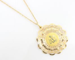 A yellow metal openwork pendant and chain, the openwork scalloped edged pendant with central