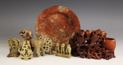 A collection of seven Chinese carved soapstone figural groups, predominantly 20th century, including