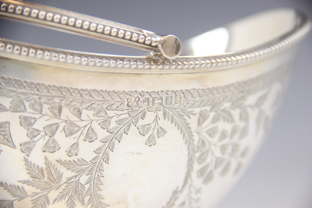 A Victorian silver swing-handled sugar basket, Fenton Brothers, Sheffield 1878, of oval form on - Image 2 of 2