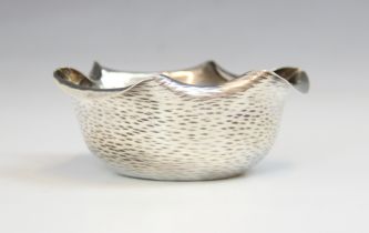 A Victorian silver bonbon dish, Hukin & Heath, London 1886, the shaped rim above planished decorated