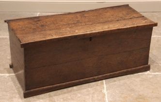 A late 18th/early 19th century oak linen chest, of rectangular form with hinged cover, opening to