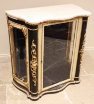 An Italian ebonised and painted marble top vitrine, 19th century, of serpentine form, the glazed