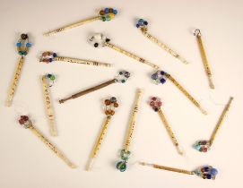 A collection of bone sweetheart lace bobbins, 19th century and later, each with carved decoration