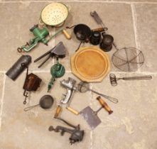 A collection of Victorian and later kitchenalia, to include: mincers, vintage cookery implements,