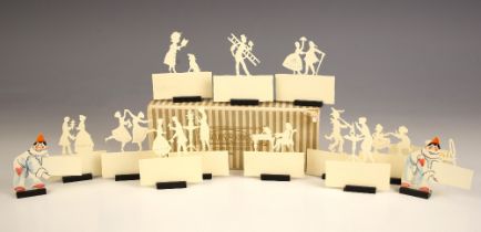 A selection of ivorine placename holders, 20th century, depicting scenes of ladies dancing, courting