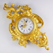 A Louis VXI style wall clock, late 19th century, the rococo style case cast with a cherub figure
